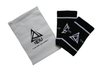 Black fitness wrist sweatband with white logo and text and storage bag